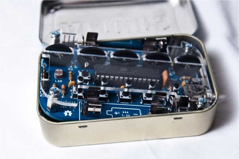 insert the audio jack through the hole in the side